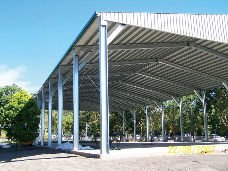 A C Section shed in a yard held up with metal beams