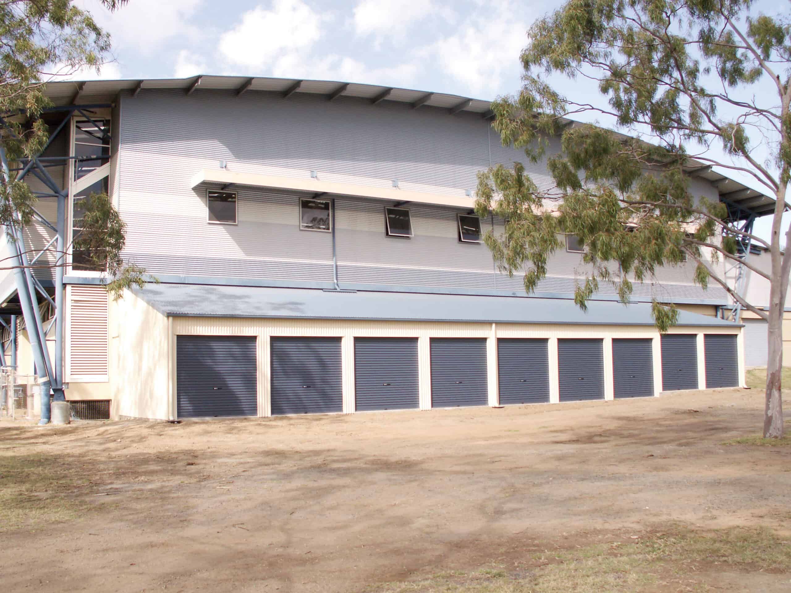 multiple roller doors on a large shed building.