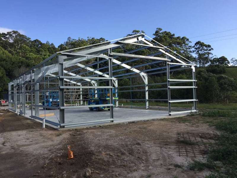 A metal shed building under construction to meet NSW shed regulations