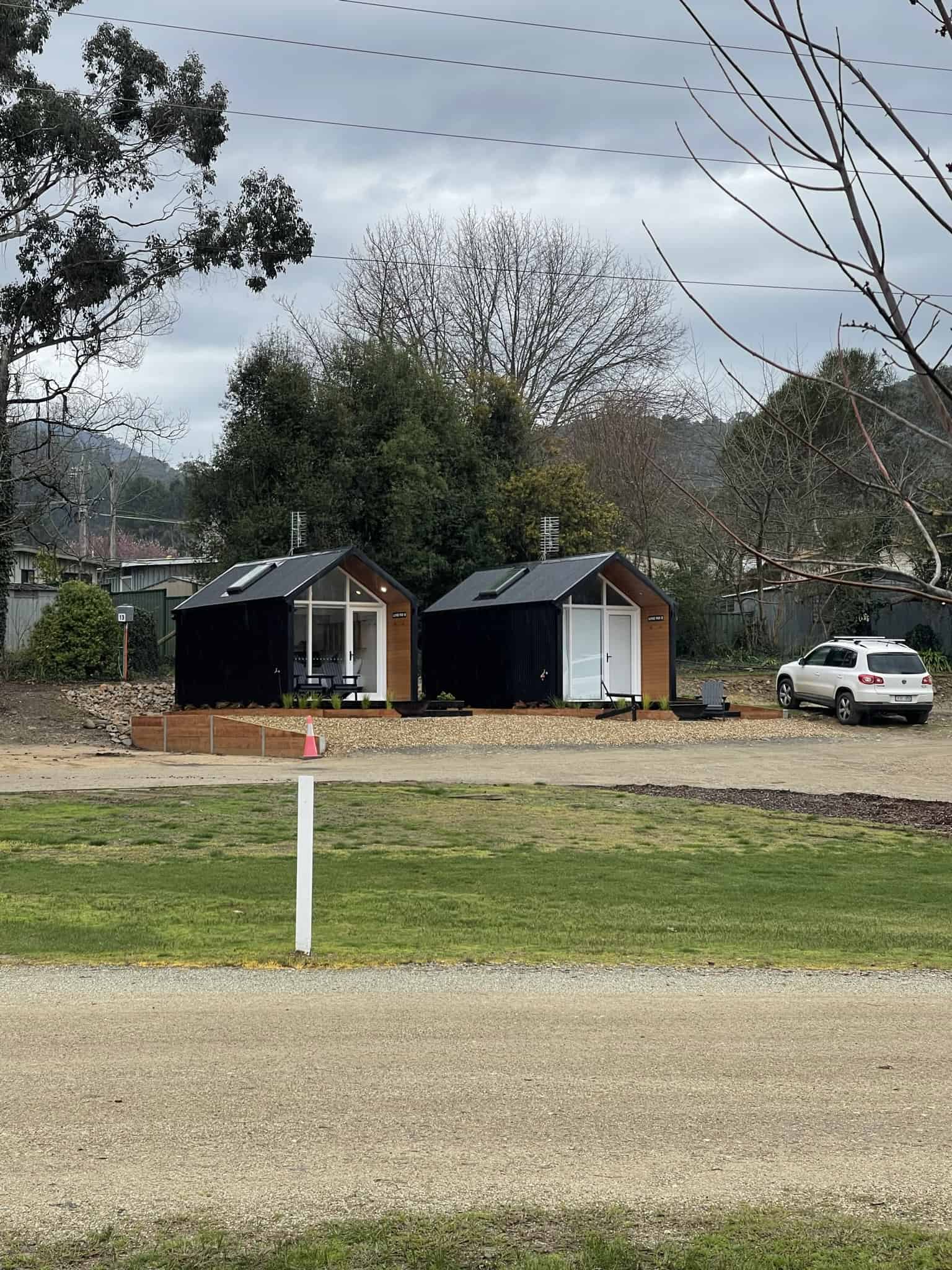 QLD Shed design two sheds with a white car
